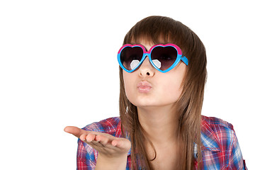 Image showing Portrait girl in sunglasseses sends air kiss