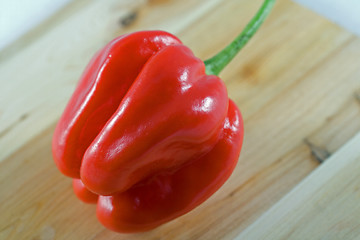 Image showing Habanero chillie on juniper wood chopping board