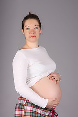 Image showing pregnant woman holding belly