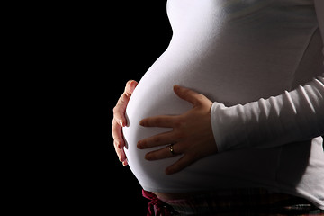 Image showing pregnant woman holding belly 