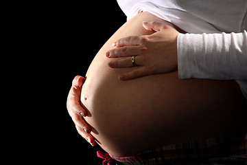 Image showing pregnant woman holding belly 