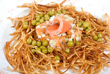 Image showing Russian salad with salmon fish closeup