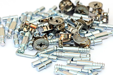 Image showing Many screws and nuts isolated on white background