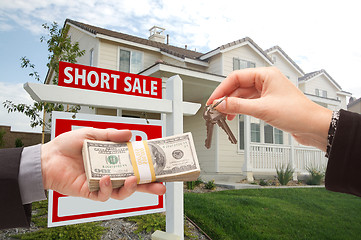 Image showing Handing Over Cash For House Keys and Short Sale Sign