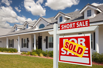 Image showing Sold Short Sale Real Estate Sign and House - Right