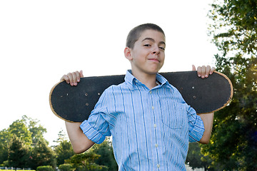 Image showing Teen with His Skateboard