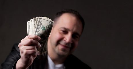 Image showing Man Holding Money
