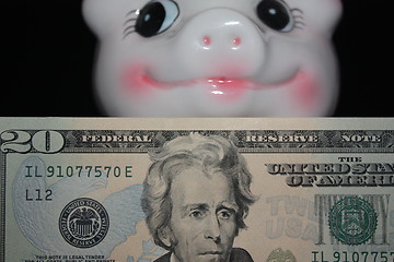 Image showing A piggy bank and money.