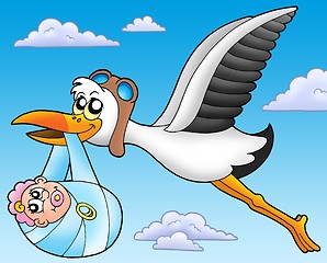 Image showing Flying stork with baby