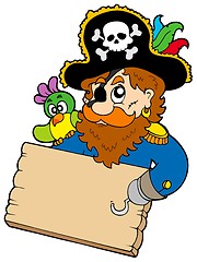 Image showing Pirate with parrot holding table