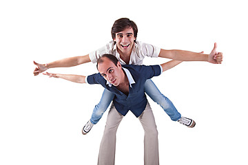 Image showing two men, one carrying on his back the other