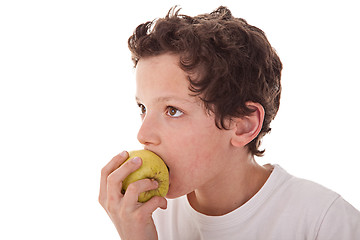 Image showing boy eating a green apple