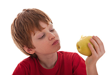 Image showing boy eating a green apple