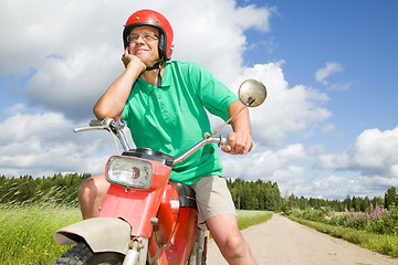 Image showing Happy man with his moped