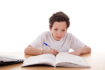 Image showing cute boy on the desk studying