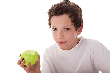 Image showing boy eating a green apple