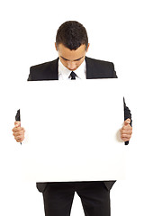 Image showing businessman holds blank sign