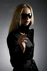 Image showing gorgeous blond smoking