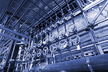 Image showing Pipes, tubes, machinery and steam turbine at a power plant