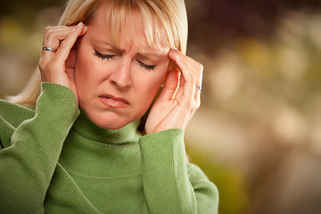 Image showing Grimacing Woman Suffering a Headache