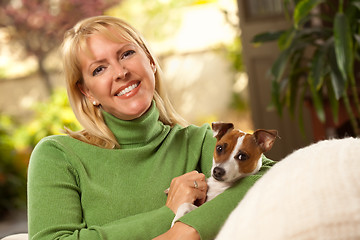 Image showing Woman and Puppy Enjoying Their Day on The Sofa