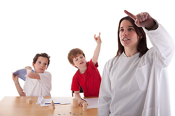 Image showing two students in the classroom, to make ugly gestures the teacher