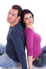 Image showing couple sitting  back to back