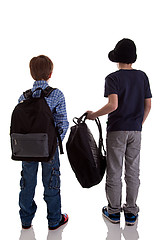 Image showing Back of schoolboy holding backpack