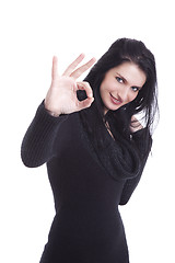 Image showing Young pretty women with thumb ok