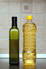 Image showing Two bottles of oil