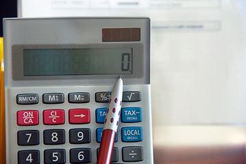 Image showing Calculator and pen