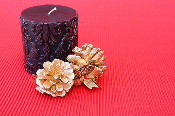 Image showing Candle and Pine Cones