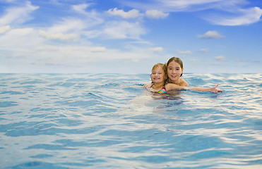 Image showing sisters in the sea