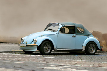 Image showing famous beetle in front of a wall