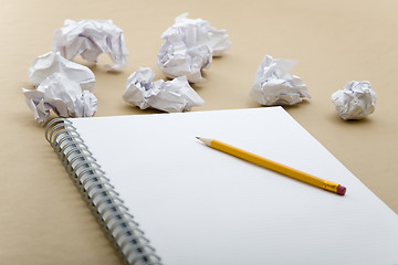 Image showing crumpled paper and yellow pencil