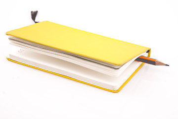 Image showing yellow notebook