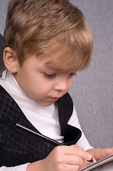 Image showing Boy writing