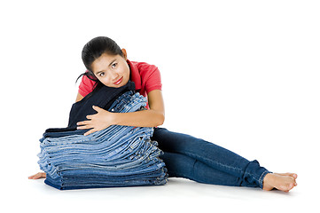 Image showing woman with lots of jeans