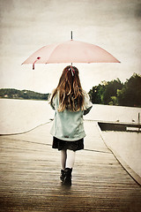 Image showing girl with umbrella on the bridge