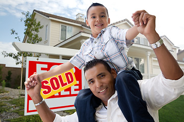 Image showing Hispanic Father and Son in Front of Their New Home