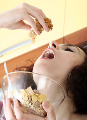 Image showing Young people eating milk with cereals