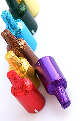 Image showing Colorful chocolate bottles