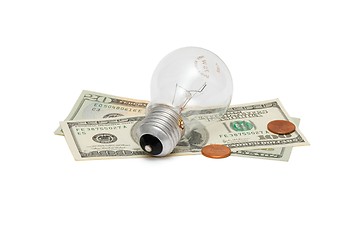 Image showing Electric bulb on dollar bills with cents isolated