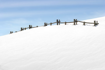 Image showing fence on snowy hill