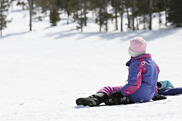 Image showing girl waiting on snowy hill