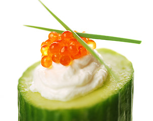 Image showing Appetizer with red caviar and a cucumber