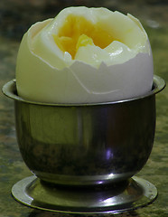 Image showing A cracked boiled egg ready to be eaten