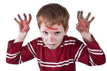 Image showing Child simulating threat, with both hands painted red and raised