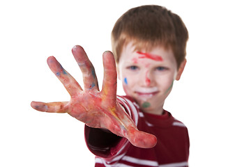 Image showing hand hint of red, with the kid blurred