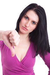 Image showing Young pretty women with thumb down